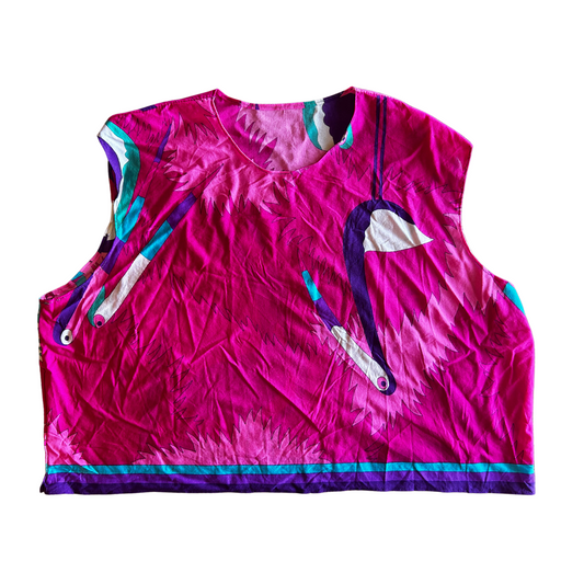 Pink sleeveless top with colorful accents on a white background