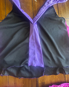 Close-up of the Mistress of Mischief Upcycled Maleficent Set's black and purple fabric top, showcasing unique women's clothing design.