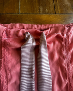 Desert Rose Sheer Kimono Fringe Skirt showcasing dusty pink fabric and elegant lace detailing.