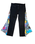 Cosmic Splash Flare Pants – One of a Kind Upcycled Statement Piece featuring vivid, colorful panels and sleek black denim.