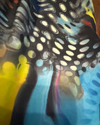 Colorful pattern detail of Cosmic Splash Flare Pants – One of a Kind Upcycled Statement Piece, showcasing vibrant design.