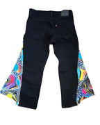 Cosmic Splash Flare Pants – One of a Kind Upcycled Statement Piece featuring colorful panels and black denim base.