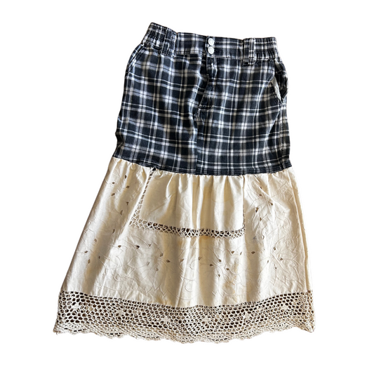 Skirt with plaid top and beige bottom with lace trim on a white background