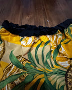 Detail of Golden Hour Tropics Two-Piece Set showing the colorful tropical fabric and elastic waistband.