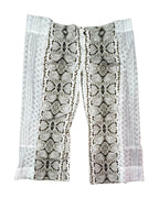Desert Viper Flare Pants featuring unique snakeskin print and patchwork details, perfect for funky women's clothing.