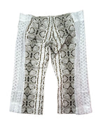 Desert Viper Flare Pants featuring unique snakeskin pattern and reclaimed fabric for funky women's clothing.