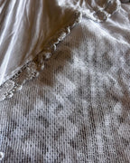 Close-up of the texture and intricate details of the fabric in the Ghost Garden Skirt – One-of-a-Kind Handmade Upcycled Statement Piece.