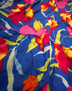 Close-up of vibrant floral print on Bloom Riot Maxi Dress, showcasing colorful statement clothing for women.