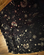 Celestial Chaos Two-Piece Set pants with celestial-print design featuring moons, stars, and planets.