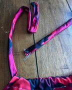 Upcycled Red Camo Halter Crop Top adjustable halter ties in bold red and black camouflage pattern, showcasing unique women's clothing design.