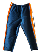 Midnight Mischief Upcycled Two-Piece Set featuring pinstripe pants with vibrant orange side panels for unique women's clothing.