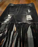 Midnight Outlaw Fringe Skirt showcasing unique hand-cut fringe and distressed denim for bold, statement fashion.