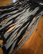 Midnight Outlaw Fringe Skirt showcasing dramatic hand-cut fringe and upcycled denim for a unique women's clothing statement.