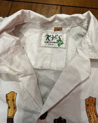 Island Strings Fringe Crop Top label from KY'S, Hawaiian made, showcasing unique, colorful women's clothing.