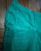 Close-up of the Emerald Flow Wide-Leg Pants showcasing vibrant emerald color and unique texture.