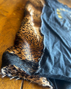 Lucky 8 Reworked Leopard Tank showing bold leopard-print side panels and raw-edge details.