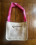 Stay Weird Cow Print Shoulder Bag with pink strap and hand-drawn design, perfect for funky women's clothing.
