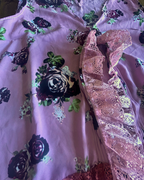 Close-up of the Midnight Rose Lace Duster, a unique women's clothing item featuring colorful floral print and lace detail.