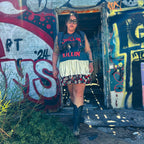 Just Chillin’ Killin’ Upcycled T-Shirt Dress worn by a model in a colorful urban setting, showcasing unique, funky women's clothing.