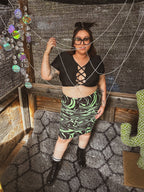 Toxic Swirl Handmade Mini Skirt – One of a Kind Upcycled Statement Piece worn by a model with accessories.