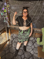 Woman wearing Toxic Swirl Handmade Mini Skirt – One of a Kind Upcycled Statement Piece, showcasing funky women's clothing.