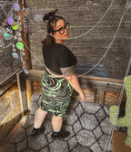 Toxic Swirl Handmade Mini Skirt – One of a Kind Upcycled Statement Piece showcased with funky women's clothing.