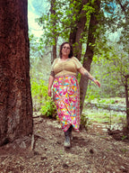 Cosmic Scarf Remix Skirt – One of a Kind Upcycled Statement Piece worn in nature, showcasing colorful, unique design.