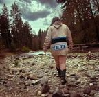 Ultra Remix Hoodie Set – One of a Kind Upcycled Statement Set worn by a woman walking by a river in nature.