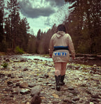 Woman walking by a river wearing Ultra Remix Hoodie Set – One of a Kind Upcycled Statement Set.