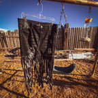 Midnight Outlaw Fringe Skirt showcasing hand-cut fringe, upcycled from black jeans, perfect for funky women's clothing.