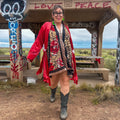 Crimson Bloom Babydoll Dress – One-of-a-Kind Handmade Upcycled Statement Piece worn in a vibrant outdoor setting.